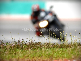 Blur image of superbike rider at a racing circuit